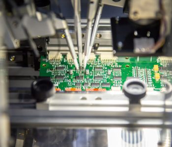 The production line of electronic board with microchip in the li The production line of electronic board with microchip in the light blue scene.The electronics board production process.